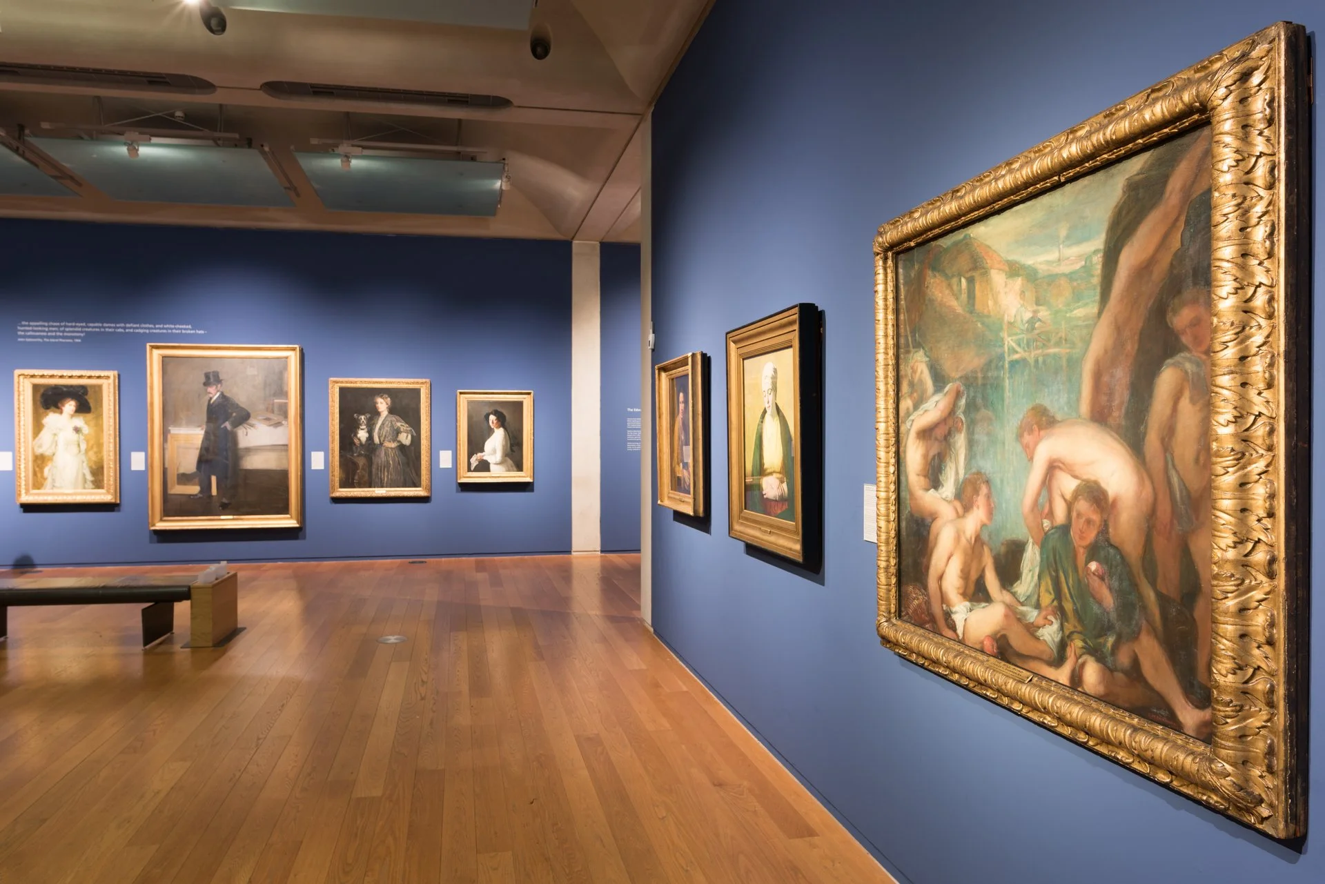 Manchester Art Gallery interior with framed paintings on blue walls