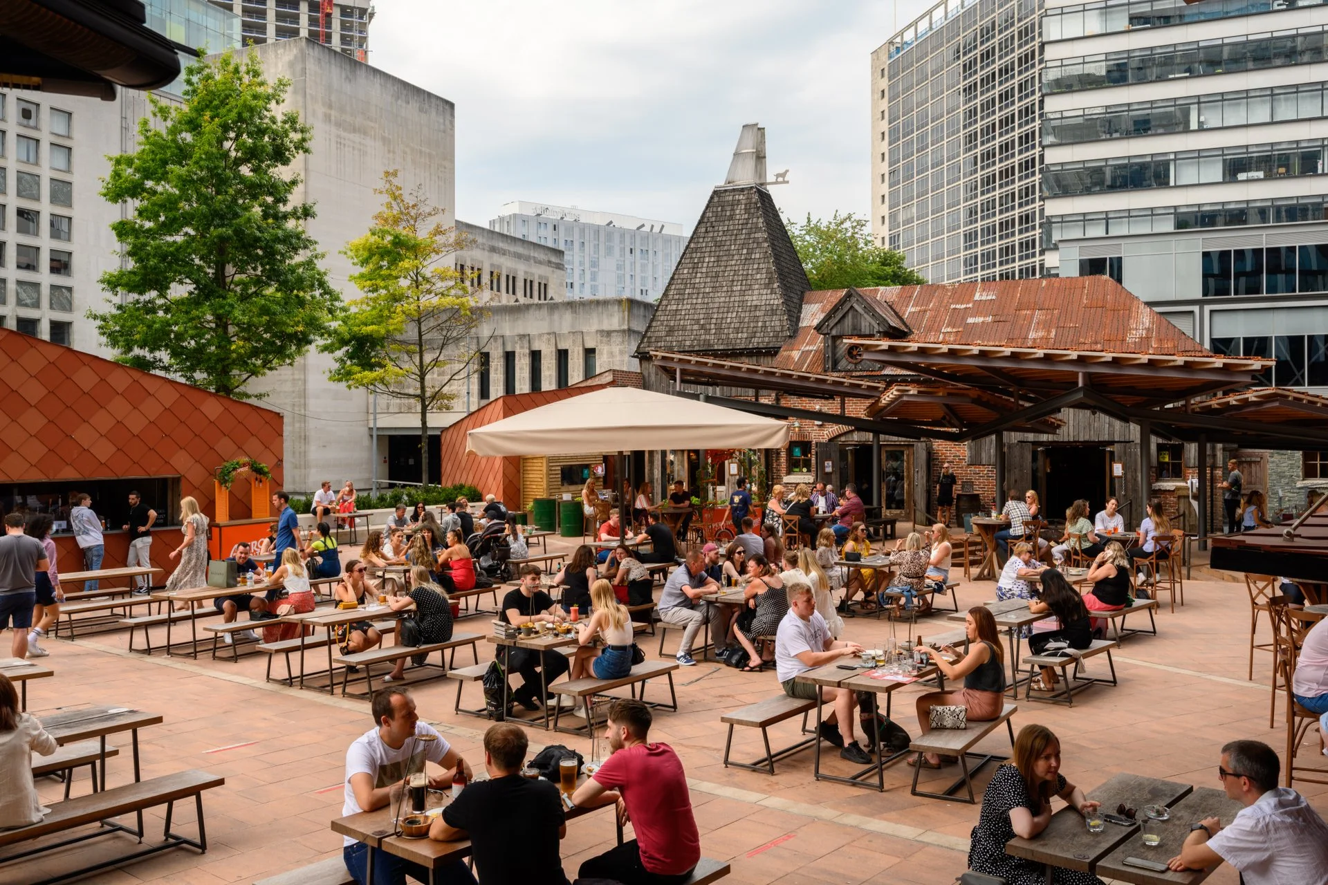 Outdoor food hall seating at The Oast House Manchester